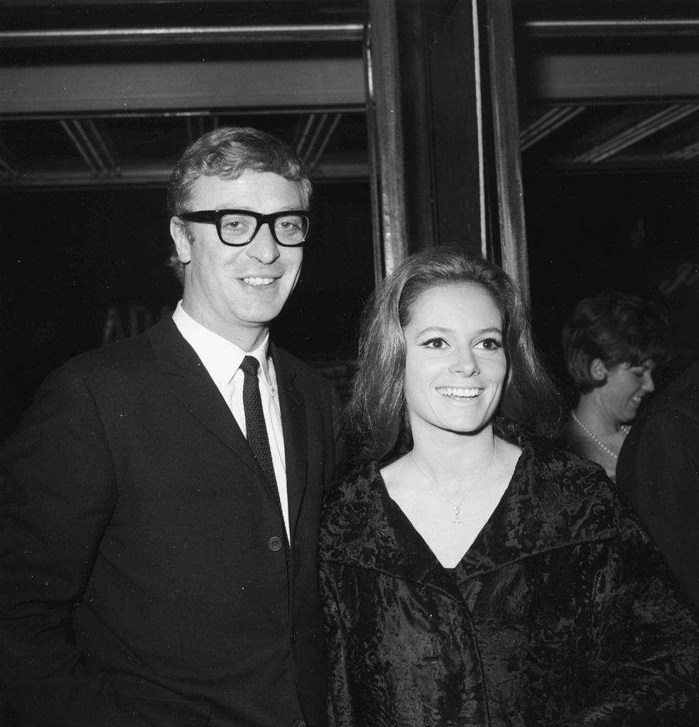Michael Caine with Luciana Paluzzi at the premiere of the film 'Repulsion', 1965.