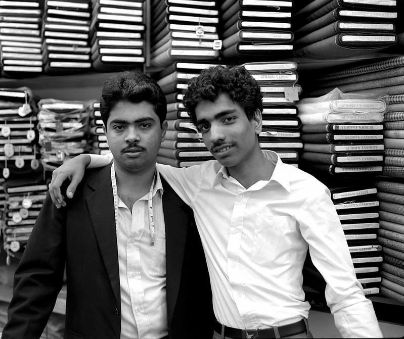 Suit tailors in their Kowloon shop. Hong Kong, 1986.