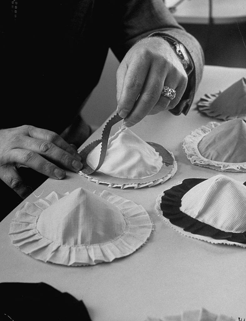 Charles L. Langs working on different designs for the adhesive bra.