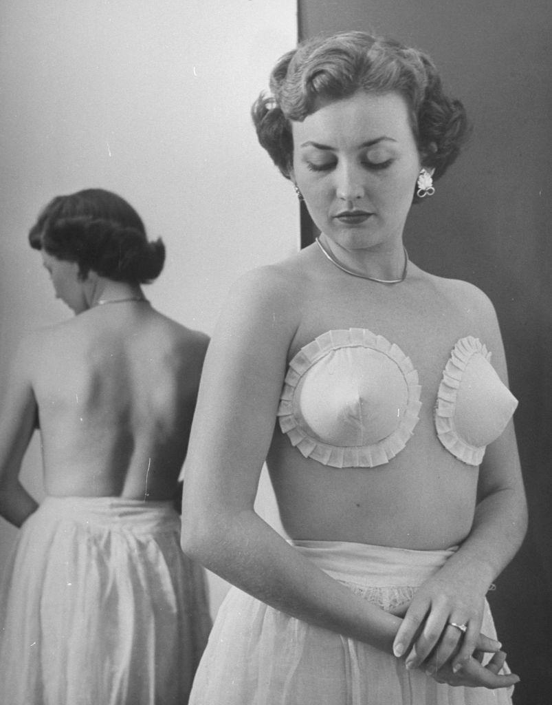 A woman wearning the strapless, backless, wireless bras adhesively gummed to hold the cup on at Jones Beach.