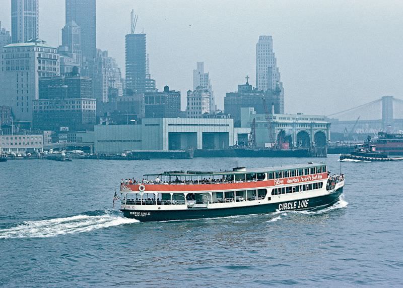 Circle Line boat, lower Manhattan, and Brooklyn Bridge, from Staten Island Ferry, New York. March 1959