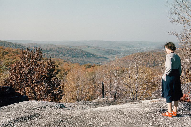 Mom looks off overlook at Rock City, New York. November 1951