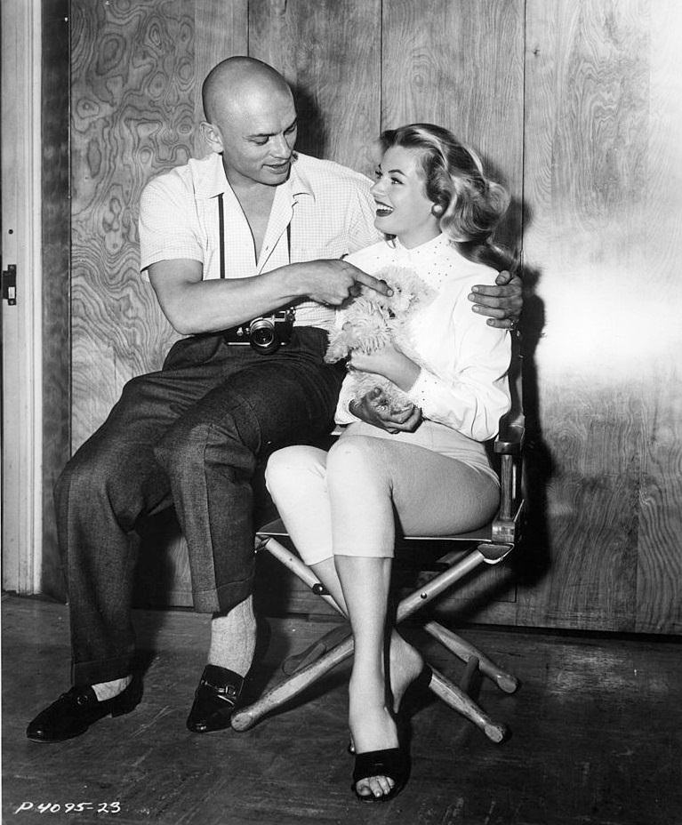 Anita Ekberg with Yul Brynner on set of the film 'Artists And Models', 1955.