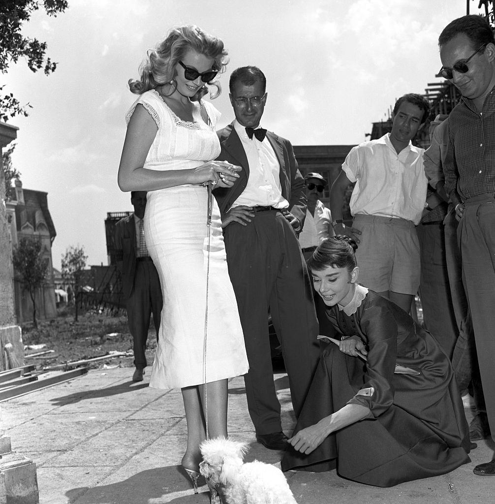 Anita Ekberg walking her dog in the streets of Cinecittà, 1956.