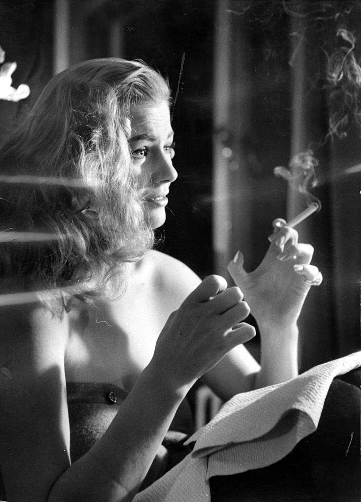 Anita Ekberg smoking a cigarette, 1957.