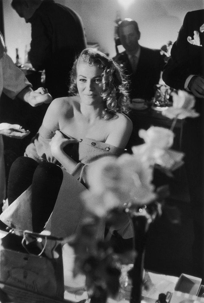 Anita Ekberg smiling during her make up session before meeting the press at the Savoy Hotel, London.