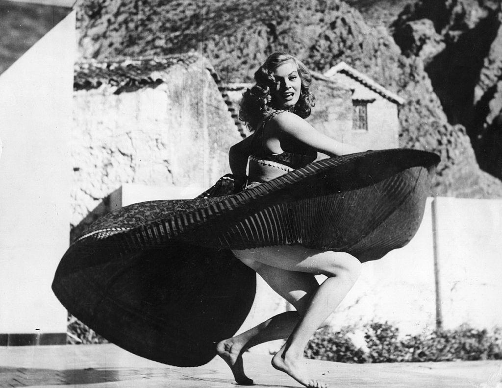 Anita Ekberg dancing barefoot on the terrace of the Parador Hotel, Spanish Morocco.