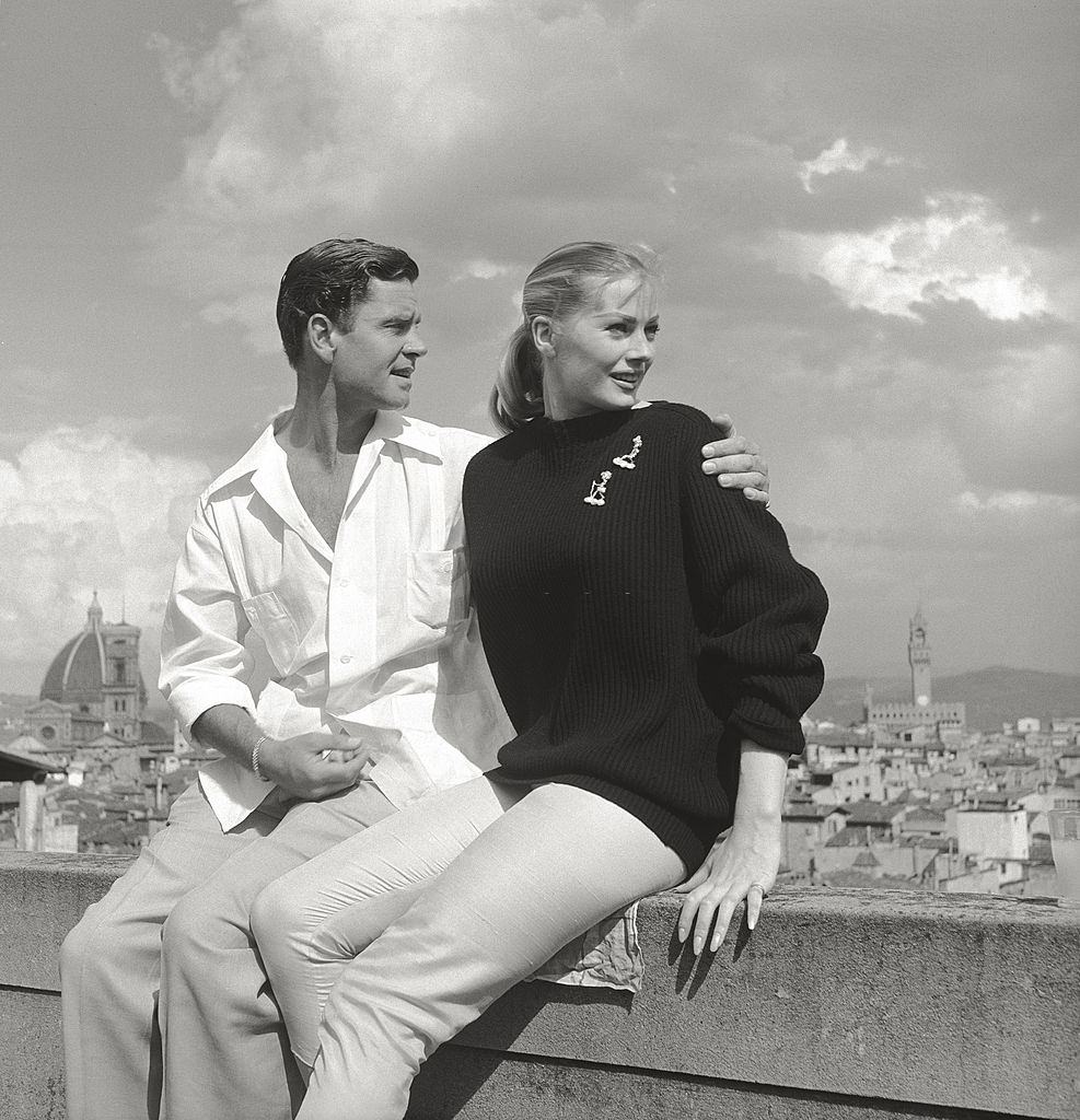 Anita Ekberg with her husband Anthony Steel on a terrace.