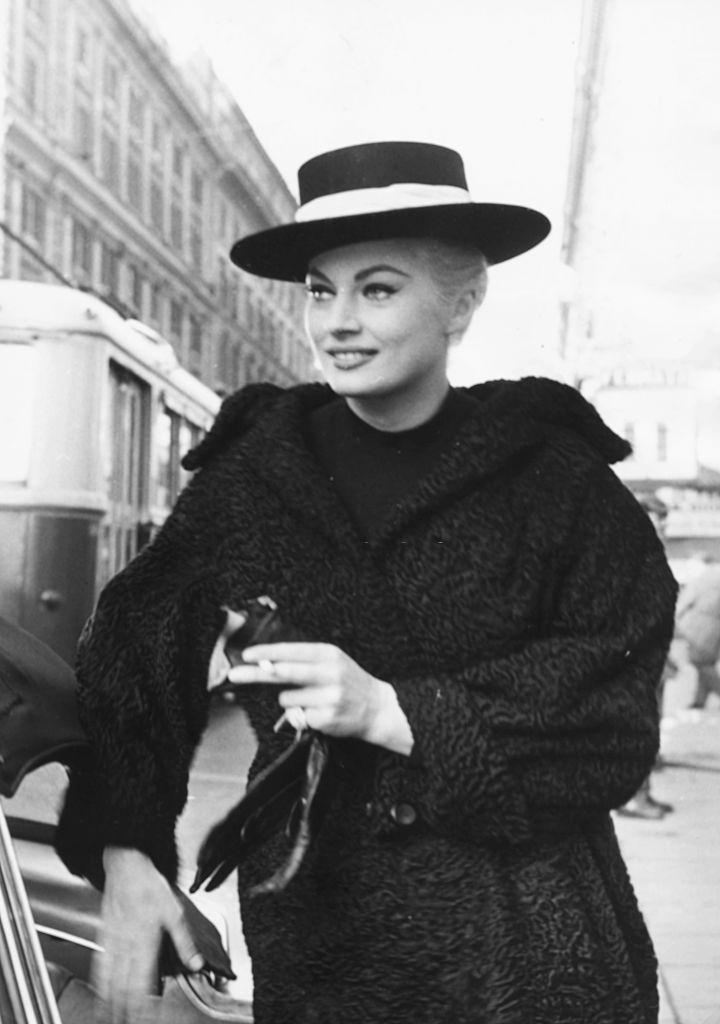 Anita Ekberg walking through the streets in Rome, where she is filming the movie 'A Sweet Life'. March 31st 1959.