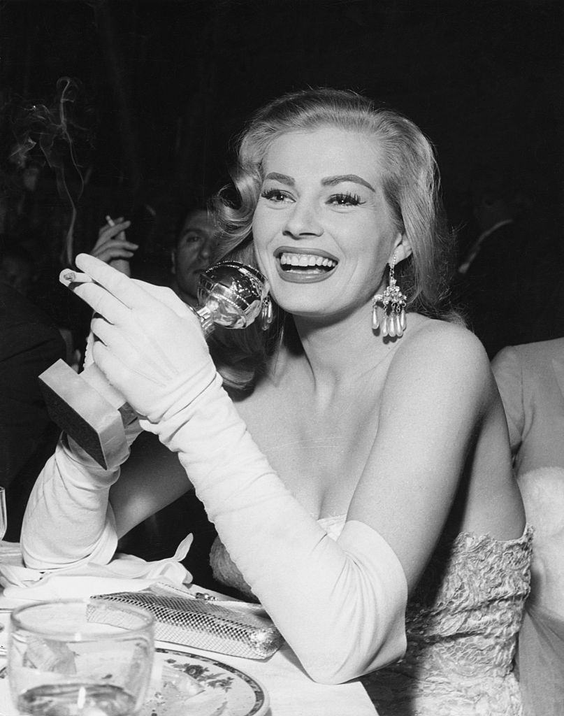 Anita Ekberg holding a Trophy. She was named the International Star of Tomorrow by the Hollywood Foreign Press, 1950.