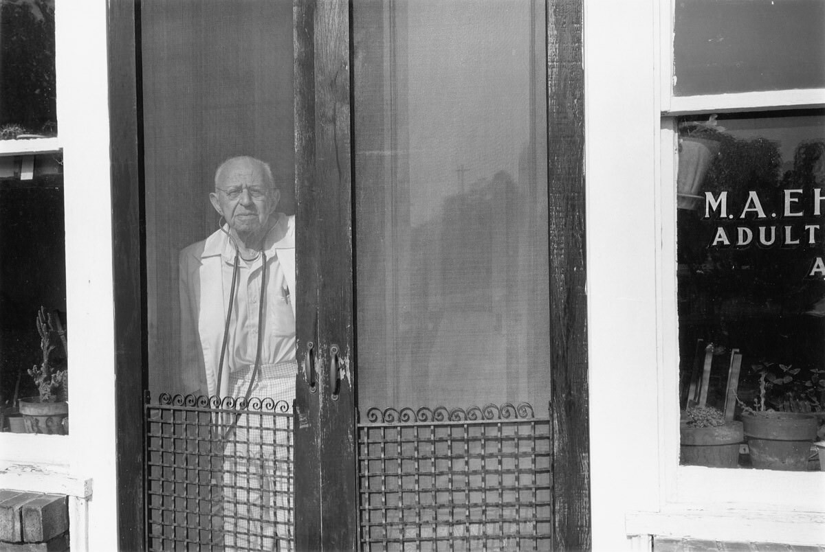 Dr. M. A. Ehrlich in the doorway of his office, 1980 Aug