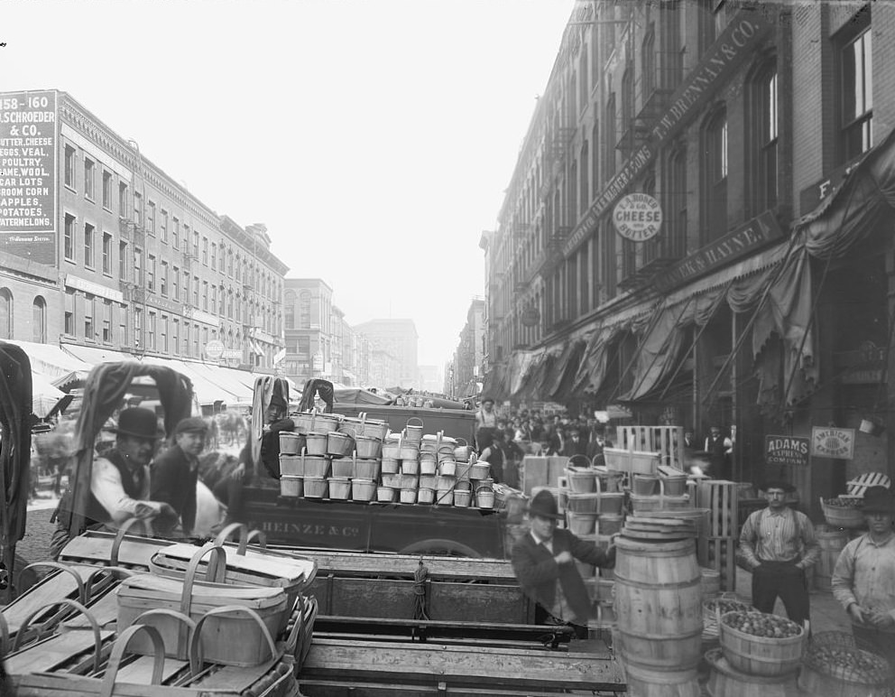 View of the merchants and passersby at the South Water Street Market in Chicago, 1910s.