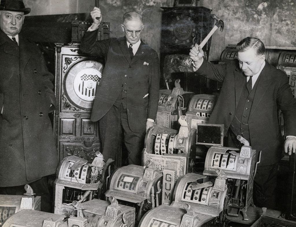 Agents Destroying Slot Machines in Chicago, 1910s.