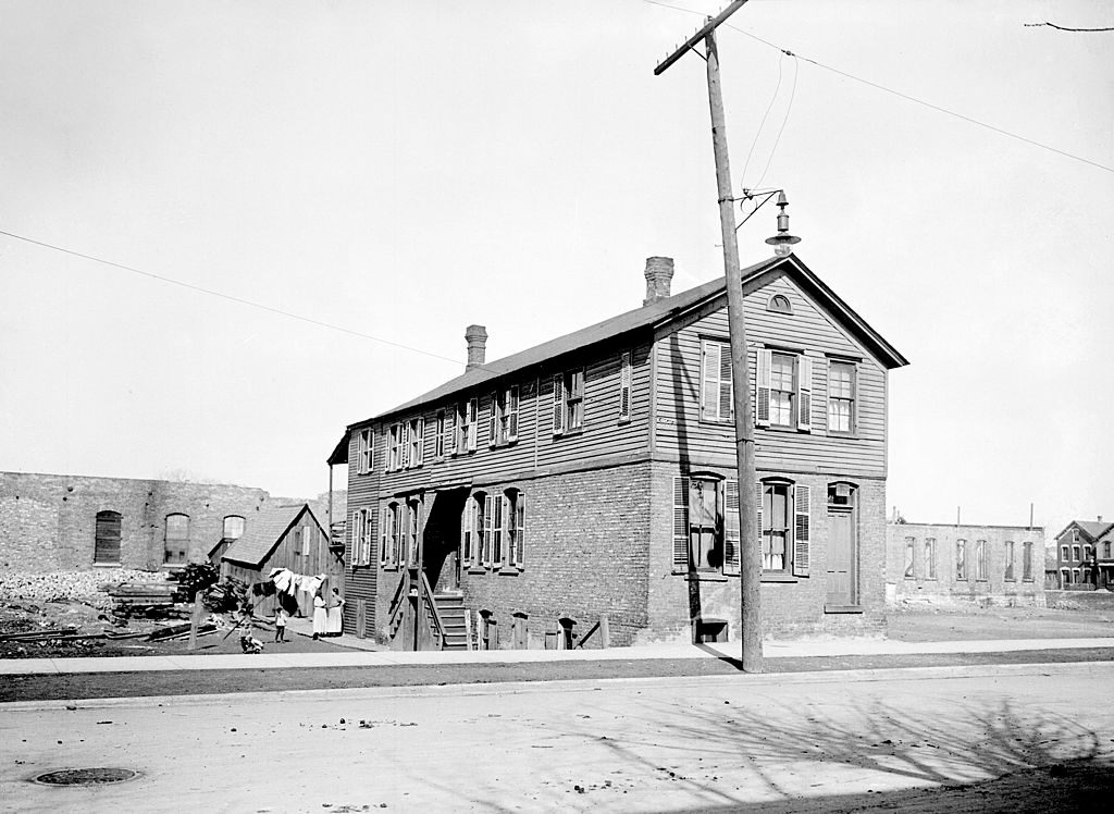 Exterior view of a building at 6657 S. State Street which operated a counterfeit coin operating racket, Chicago, 1911.