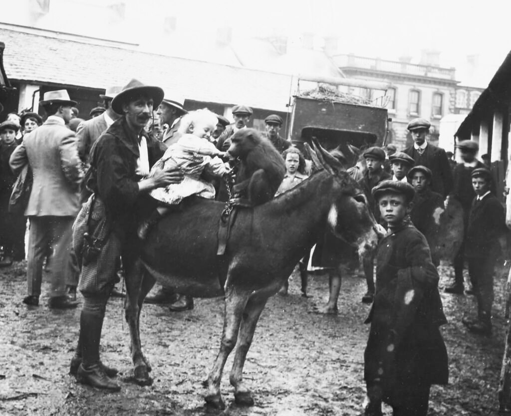 A child with a baboon on a donkey. Buff Bill's Circus, 1910.