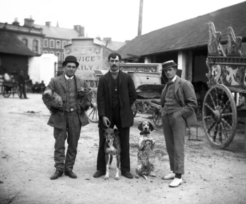 Three men and two dogs, 1911.