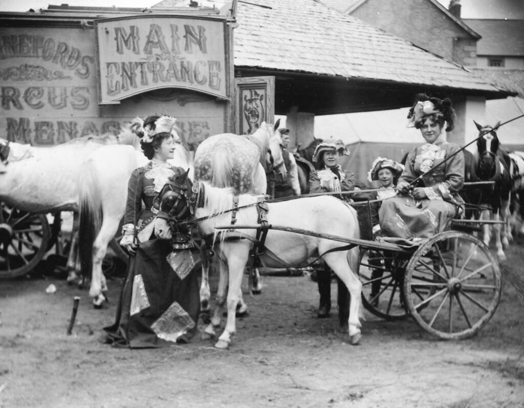 Circus performers in a horse and cart. Hanneford's Canadian Circus, 1910.