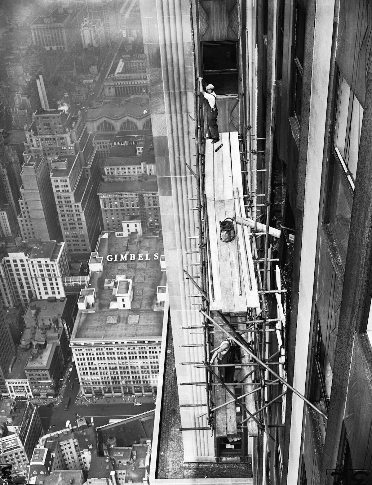 Workmen erect scaffolding on the 33rd Street Side of the Empire State Building as reconstruction work on the skyscraper begins.