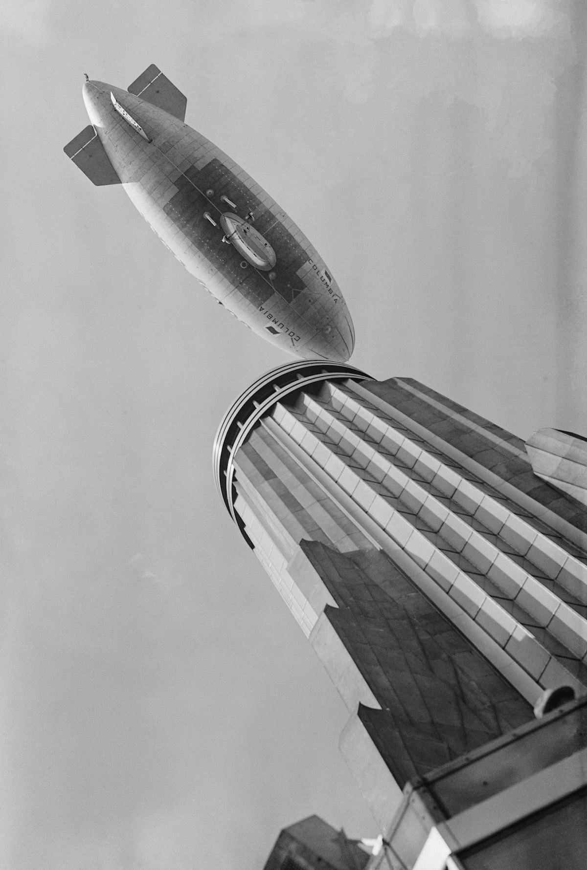 A 'blimp' flying over the Empire State Building.Sep. 29, 1931