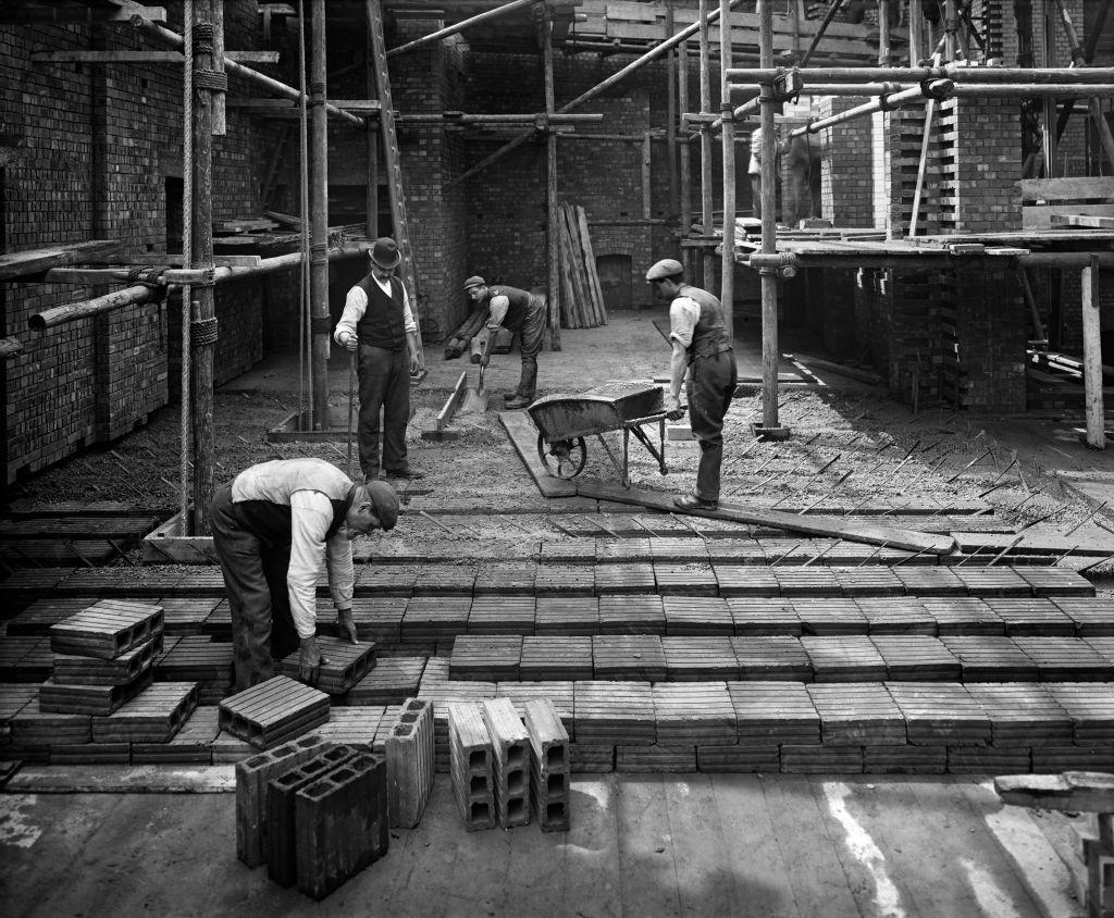 Construction workers laying a hollow pot floor, 8 Lloyds Avenue, City of London, 1907.