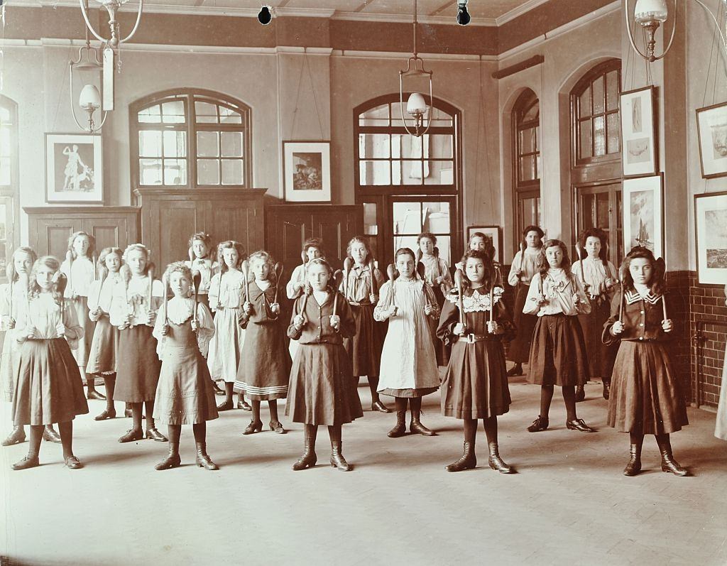Girls holding Indian clubs, Cromer Street School/ Argyle School, St Pancras, London, 1906.