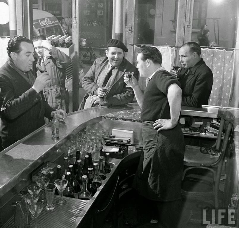 A group of people trying the Coca Cola.