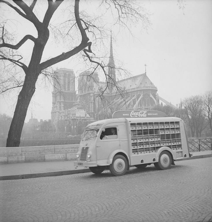View of a Coca-Cola delivery truck as it crosses Pont de l’Archeveche, near the cathedral Notre Dame de Paris.