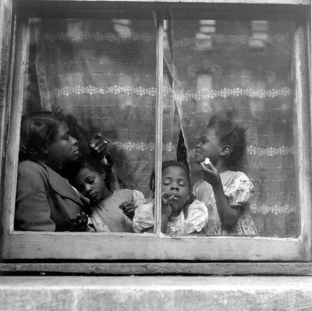 A young girl named 'Rebecca' and her family, 1947.