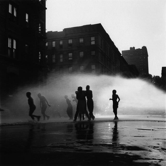 Children playing in water, 1948.