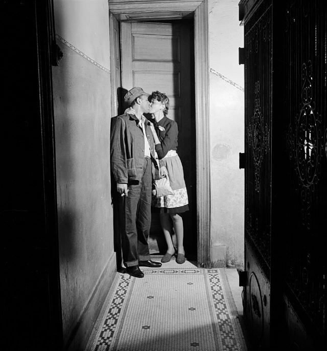 A couple kissing in the hallway, 1942.
