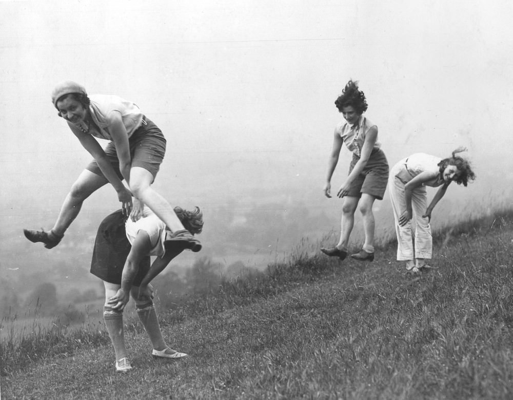 Girls playing a game of leap-frog, circa 1938.