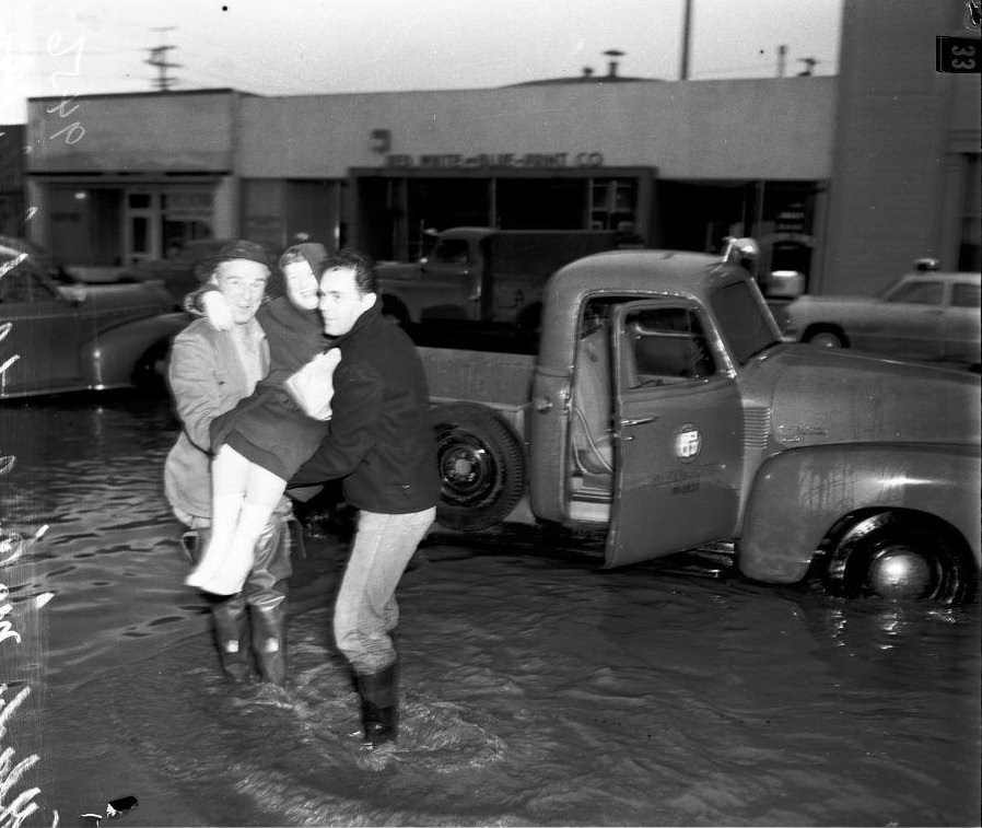 Legionnaires helping old woman to truck, 18 January 1952.