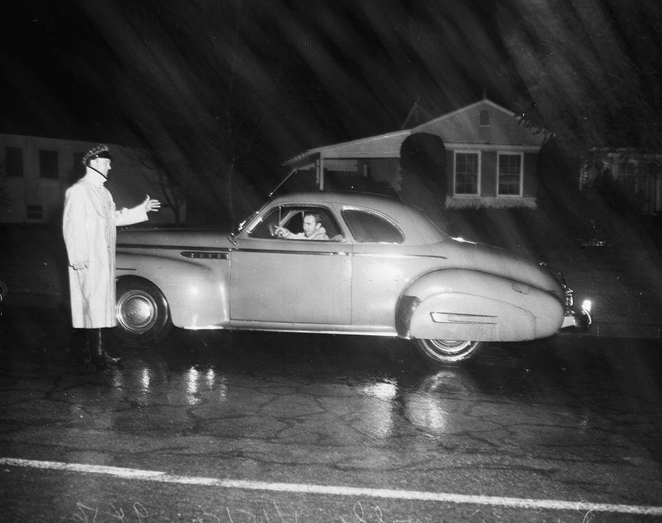 Police stopping cars at Beverly Glenn Blvd. 15 January 1952.