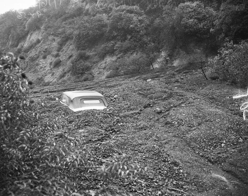 Top of buried car after a landslide at Mulholland Drive, Los Angeles. 16 January 1952.