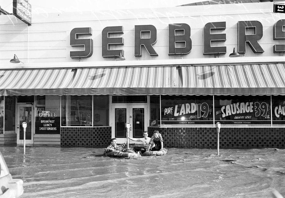 Kids in life rafts floating along Van Nuys Blvd. 18 January 1952.