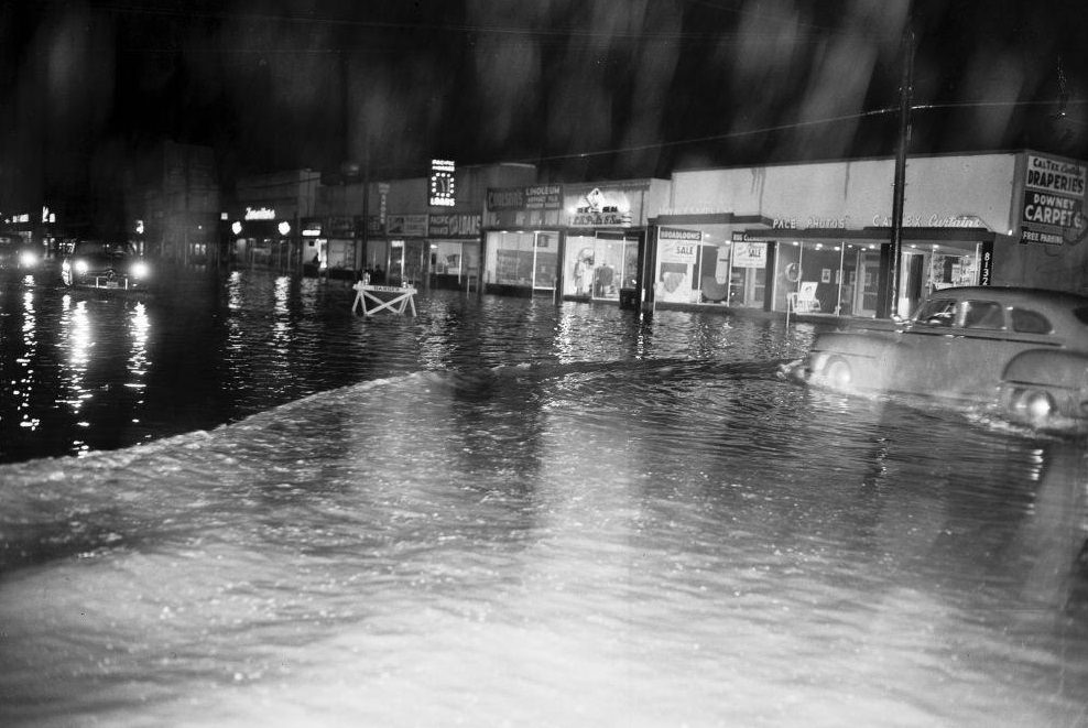 Stalled car half submerged on Ramona Freeway, West of Atlantic Boulevard. 1952.