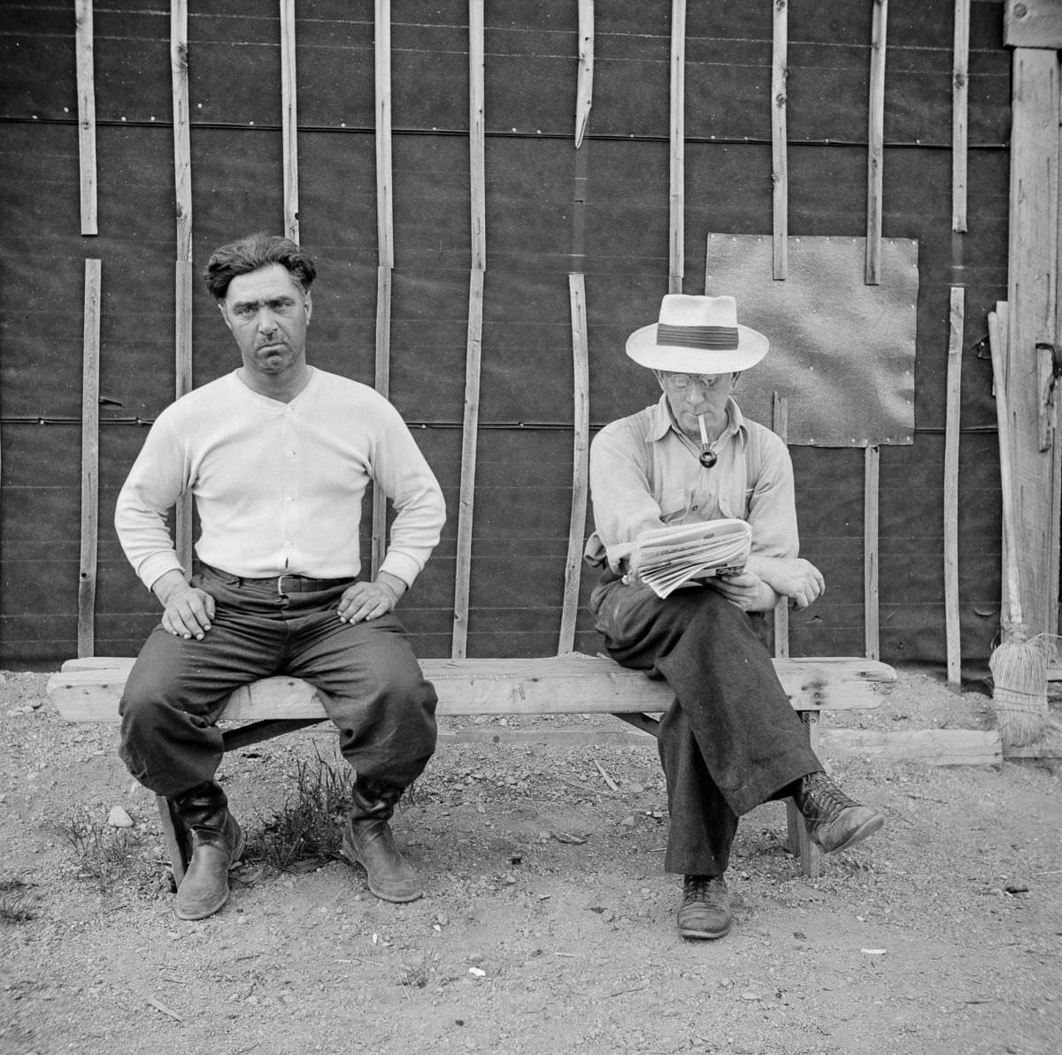 Woodsmen relax outside the bunkhouse.