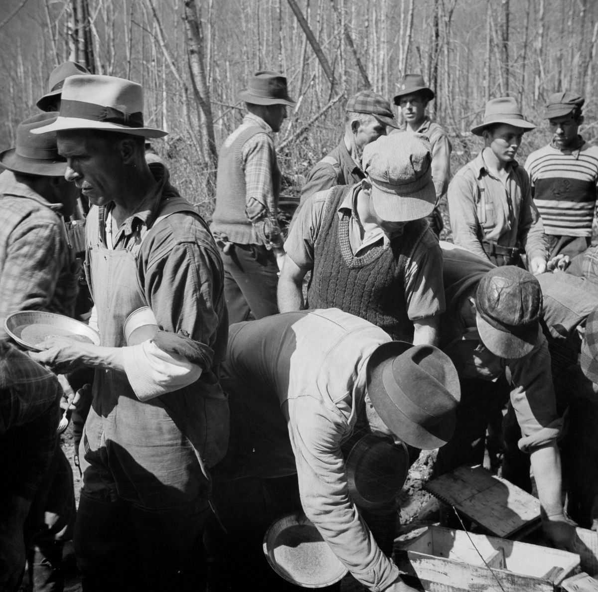 Woodsmen line up for one of their four meals a day.