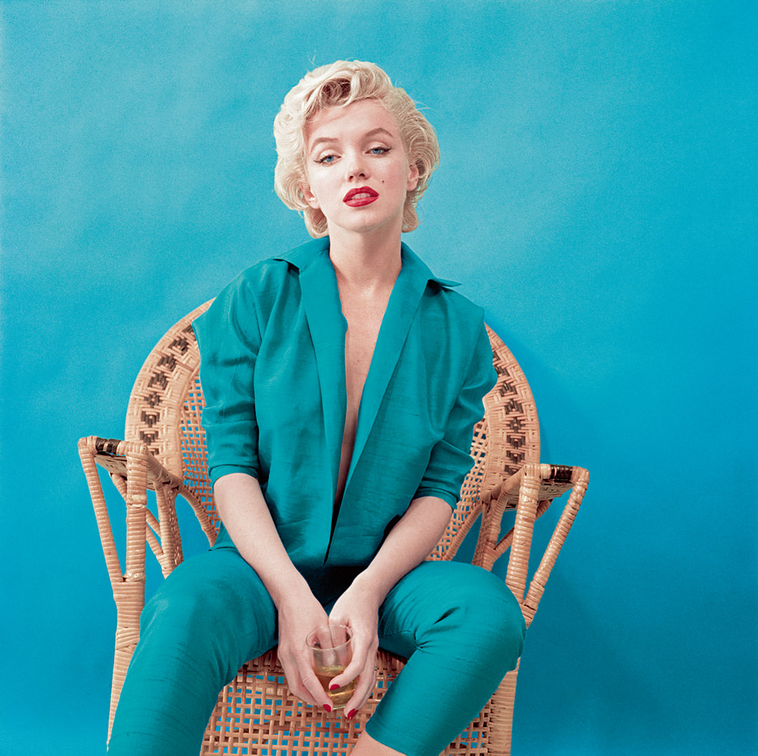 Monroe wears a jacket and matching trousers for a studio shoot in March 1955. This retro style became a signature look for her.