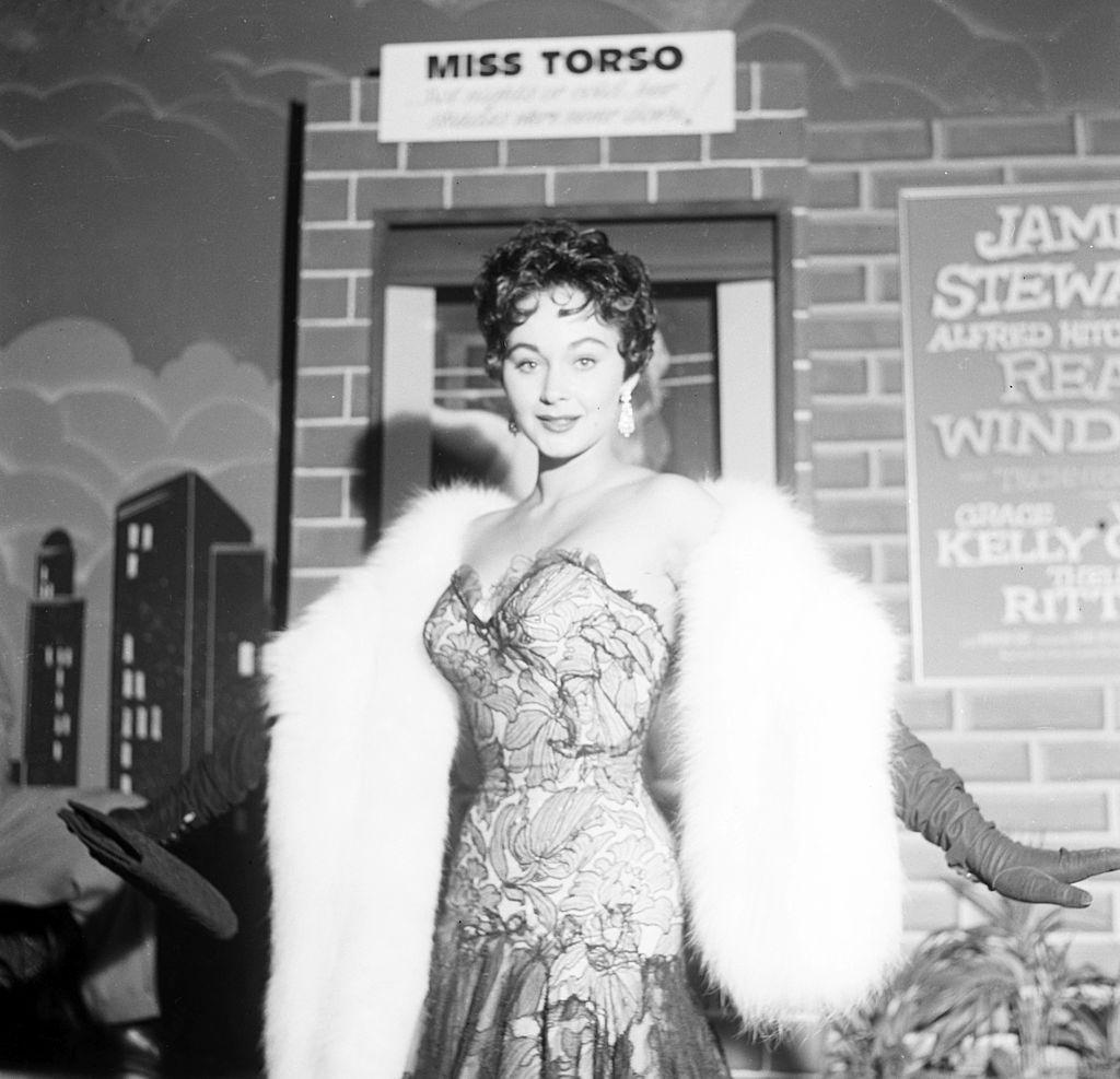 Marla English posing during a fashion photo shoot, 1954.