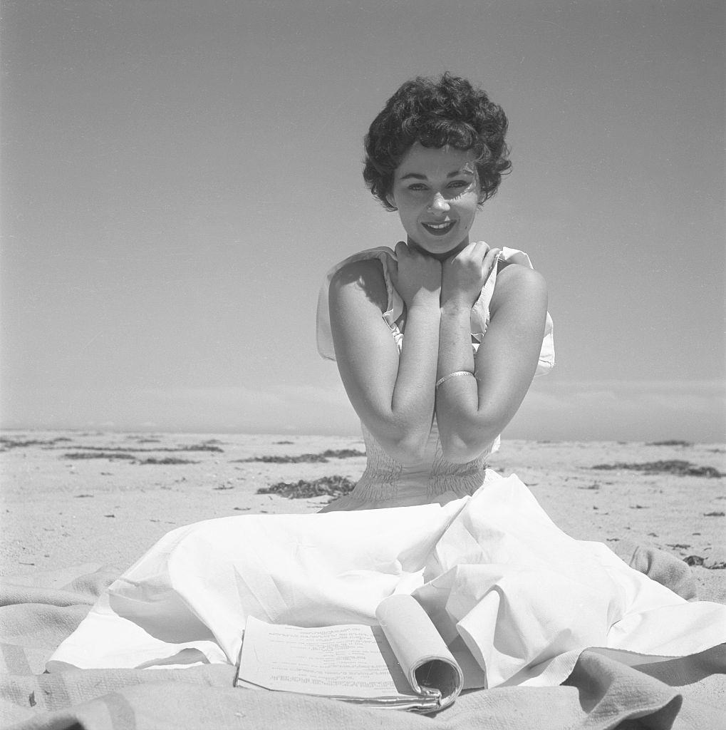 Marla English poses at the beach in Los Angeles, 1956.