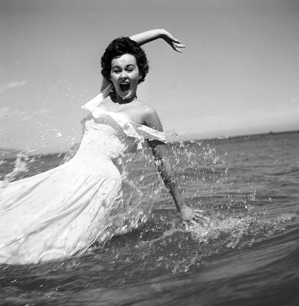 Marla English poses at the beach in Los Angeles, 1954.