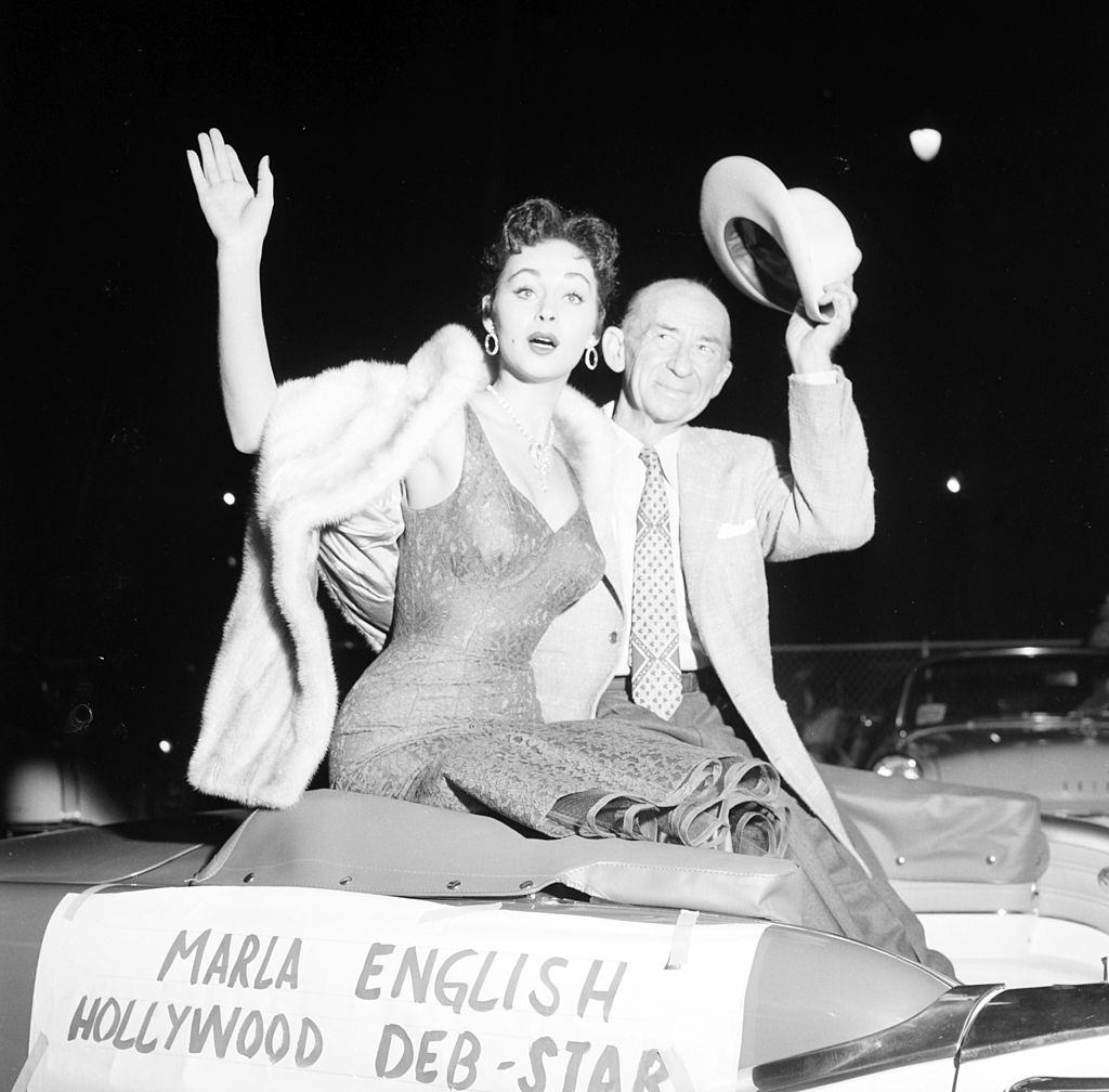 Marla English waves with Roscoe Ayes as the Hollywood Deb-Star in Los Angeles, 1955.