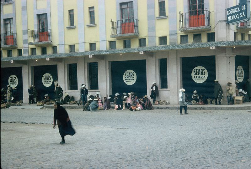 Waiting for the bus in front of Sears, Queretaro. December 1958