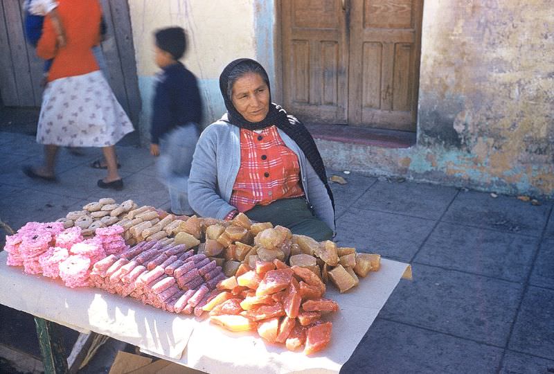 Candy vendor during Festival of Guadalupe, Saltillo. December 1958