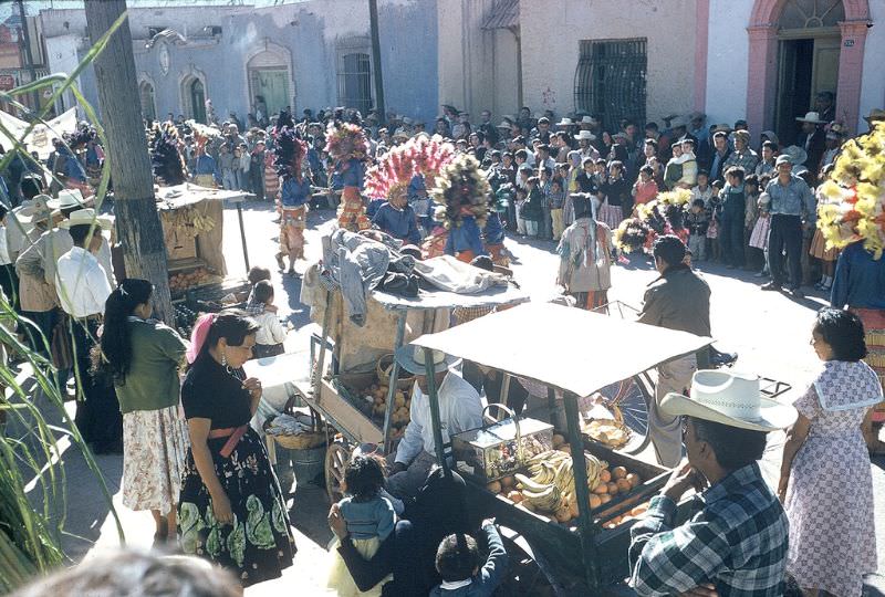 Dancers, vendors, and crowd at Festival of Guadalupe, Saltillo. December 1958