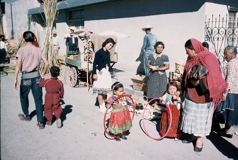 Mexican children with hula hoops, Saltillo. December 1958