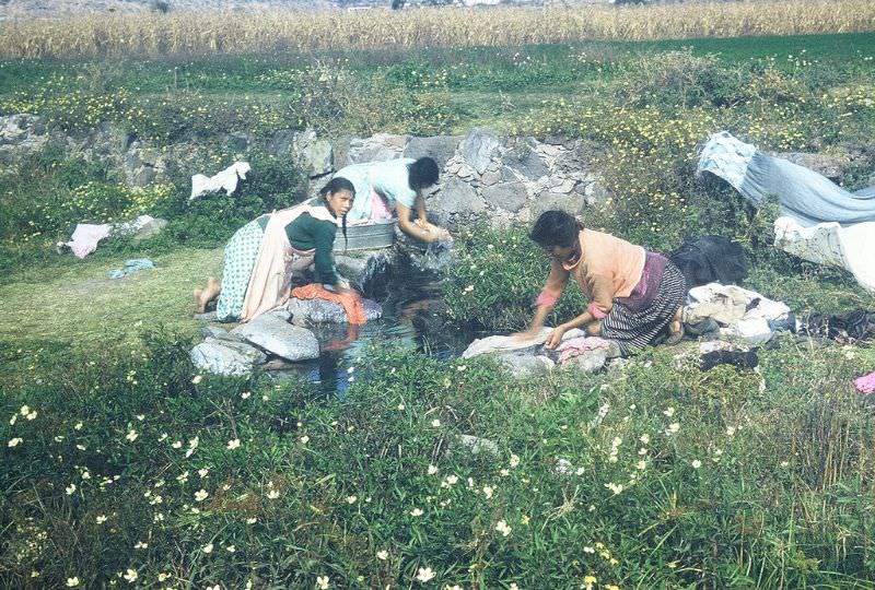 Women doing laundry in a stream, northern Mexico, December 1958