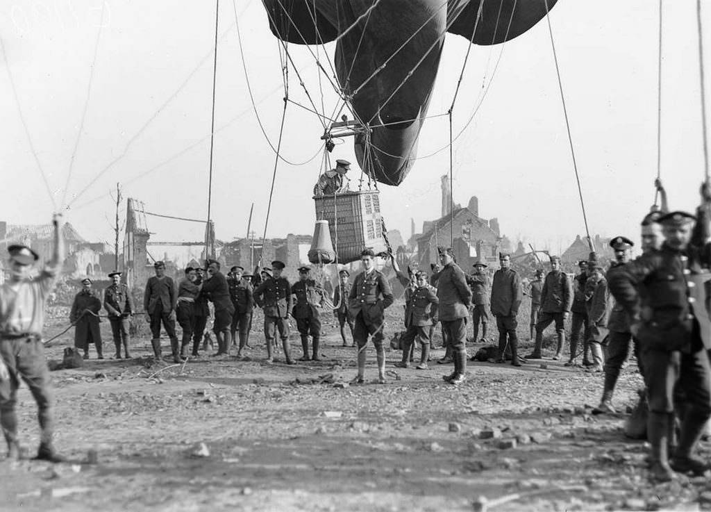 An officer prepares to ascend in an observation balloon near the ruins of Ypres, Belgium, 1917.