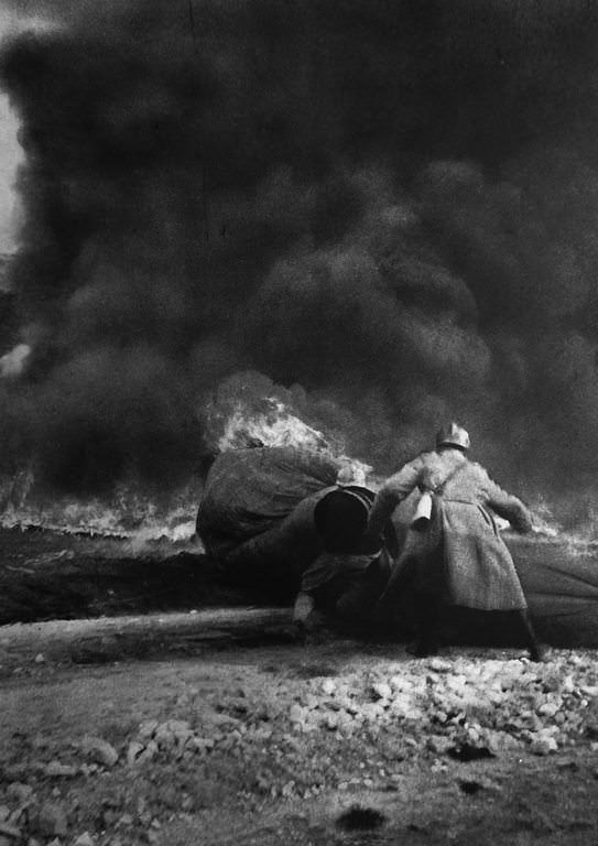 A balloon burns on the ground after a German aerial attack, 1916.